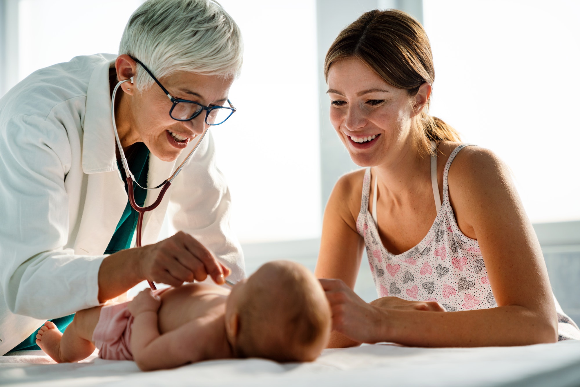 Pediatrician doctor examines baby. Healthcare, people, examination concept